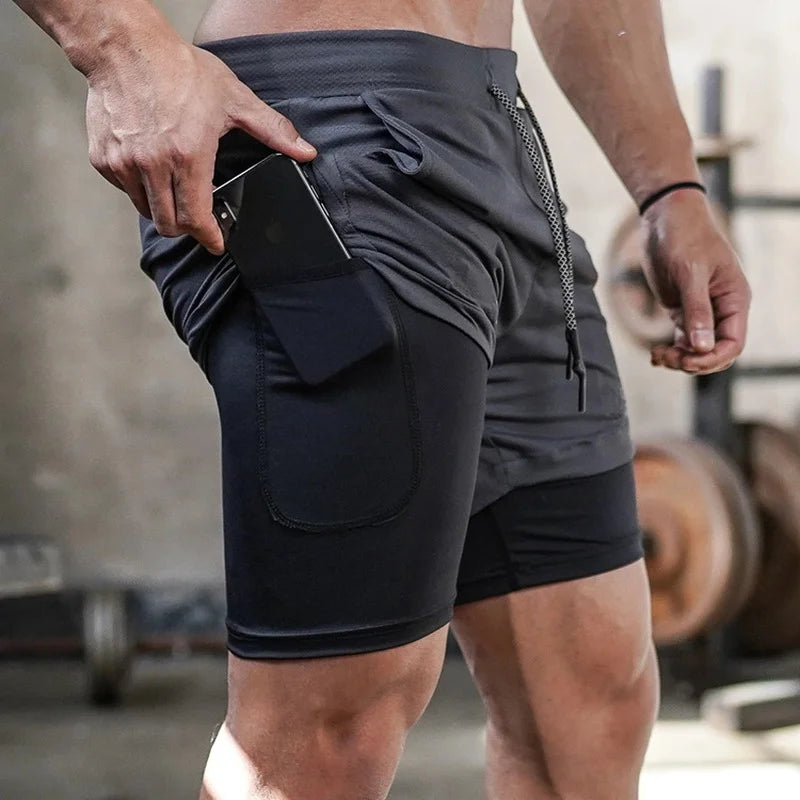 Camo men's 2-in-1 athletic shorts, featuring built-in compression liners and a secure side pocket for your phone or essentials. Designed for running, training, and gym workouts, they offer support, flexibility, and performanc